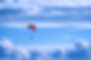 person%20in%20red%20parachute%20under%20