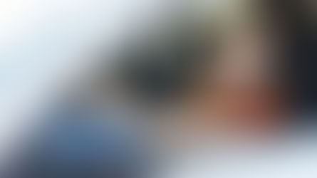 Teenage driver checking side mirror before changing lanes.