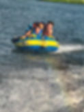 Tubing Behind Pontoon.jpeg