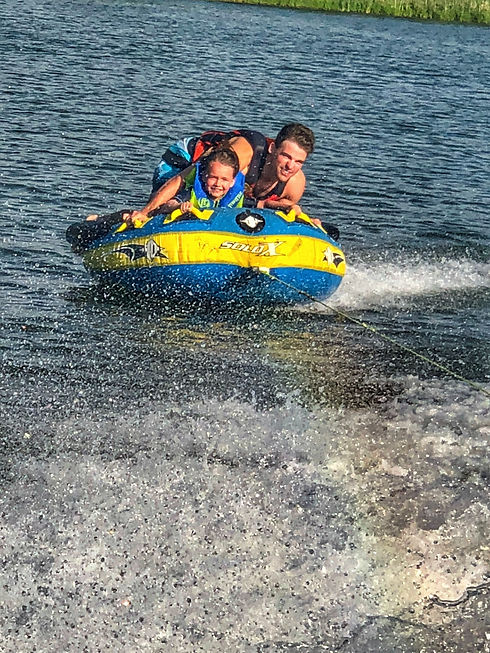 Tubing Behind Pontoon.jpeg