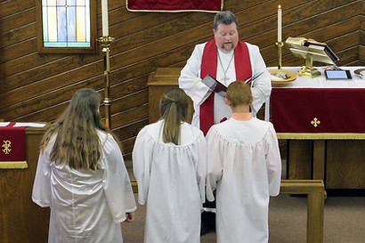 Confirmands begin confirmed by the pastor