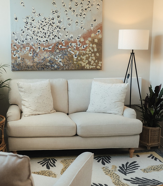 A white sofa in a treatment room at The Knightsbridge Practice