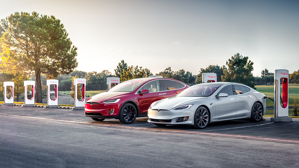 Tesla model S tesla model y super charger station white and red