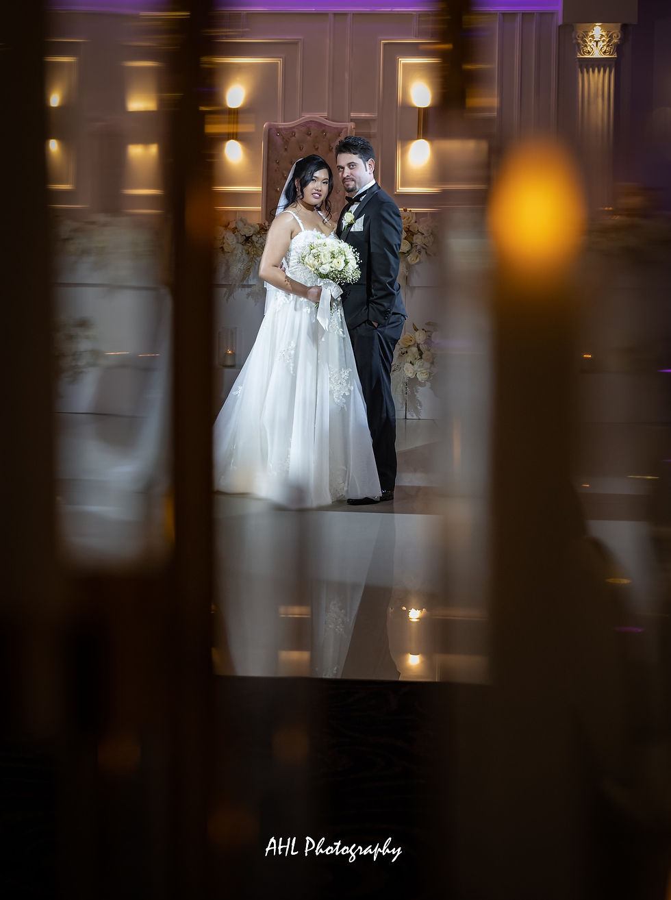 Bride and Groom standing at Reception