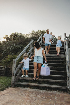family walking to the beach to have fun