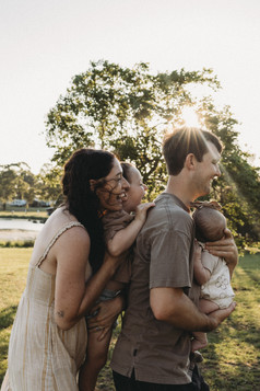 family playing fun games outdoors during a family photoshoot with Nikki Coleman photography in nsw 