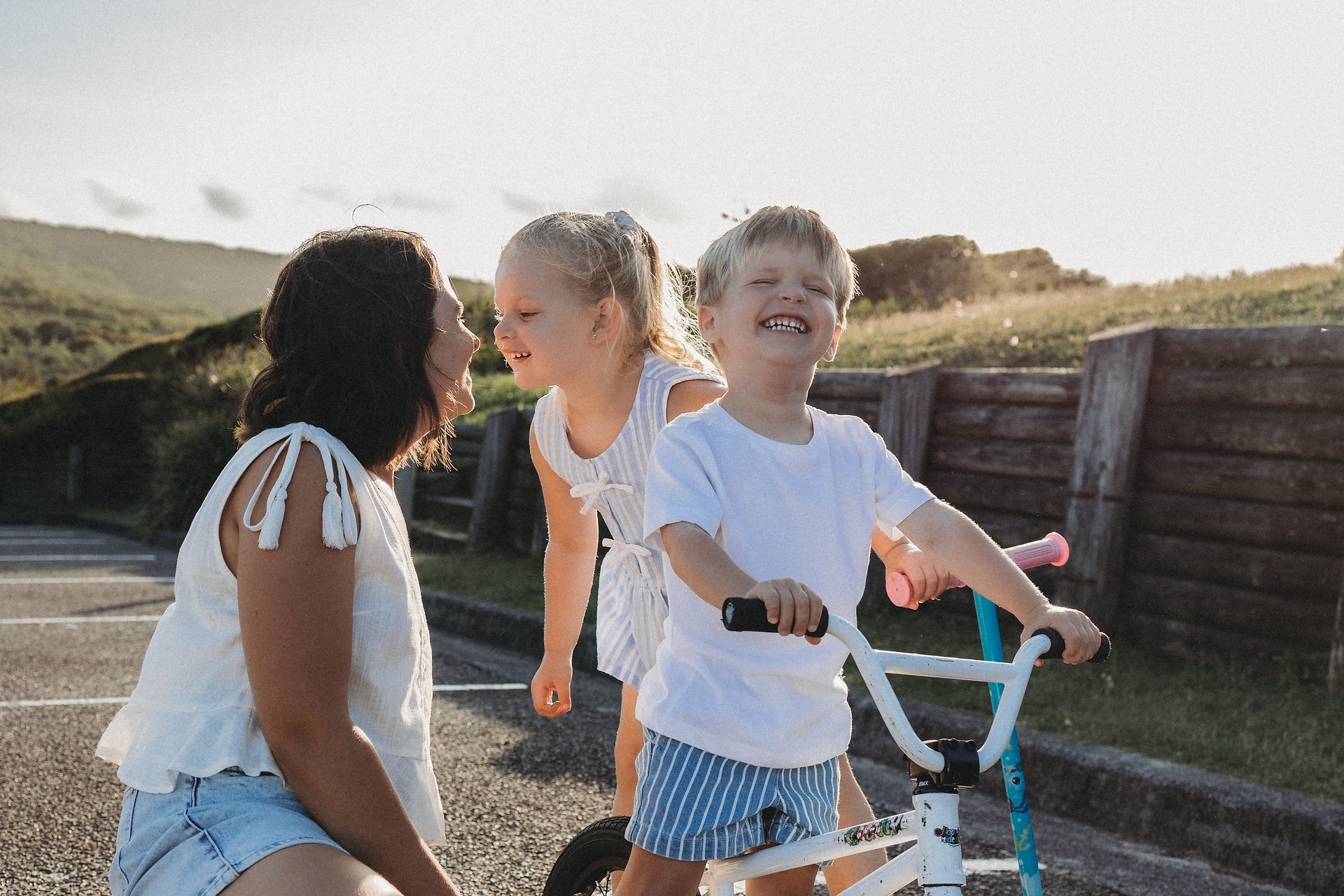 mum giving kids kisses and having fun
