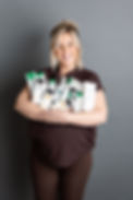 nurse shelley holding a range of cellderma skincare products