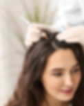 Woman getting hair looked at for treatment