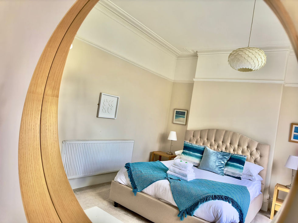 Reflective view of a coastal Airbnb bedroom