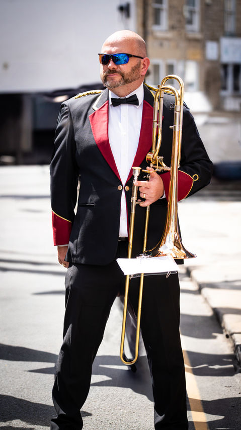 Man in suit with trombone