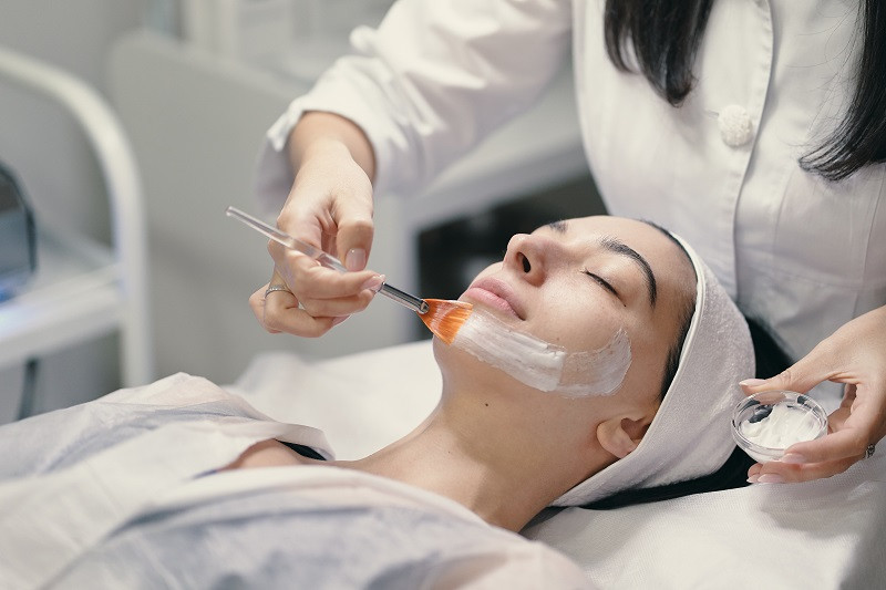 Woman with skincare specialist