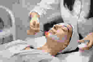 Woman with skincare specialist
