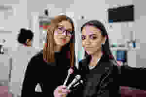 Cosmetologist applying makeup esthetician programs in orlando fl