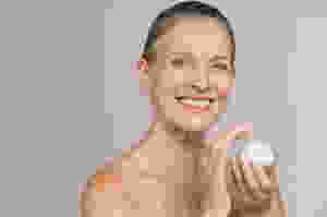Lady with Facial Moisturizer best cosmetology schools in Orlando fl