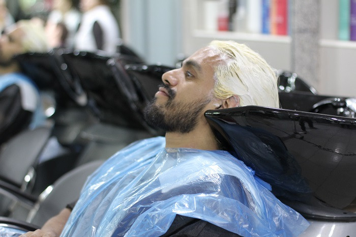Hairdresser coloring hair
