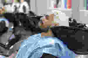 Hairdresser coloring hair