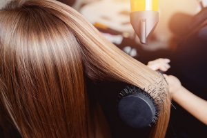 cosmetology hair school orlando fl Woman Blow Drying Hair
