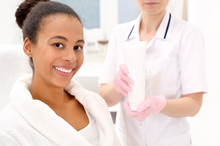 Esthetician Applying Client Makeup