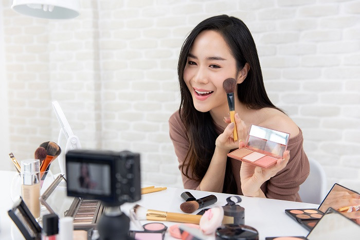 Beauty vlogger recording video