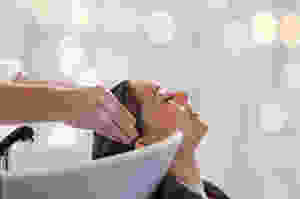 Putting Hair Color Palette Against Client’s Hair