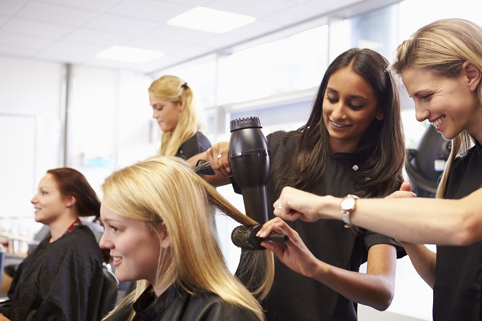 Teacher Helping Student with Hair