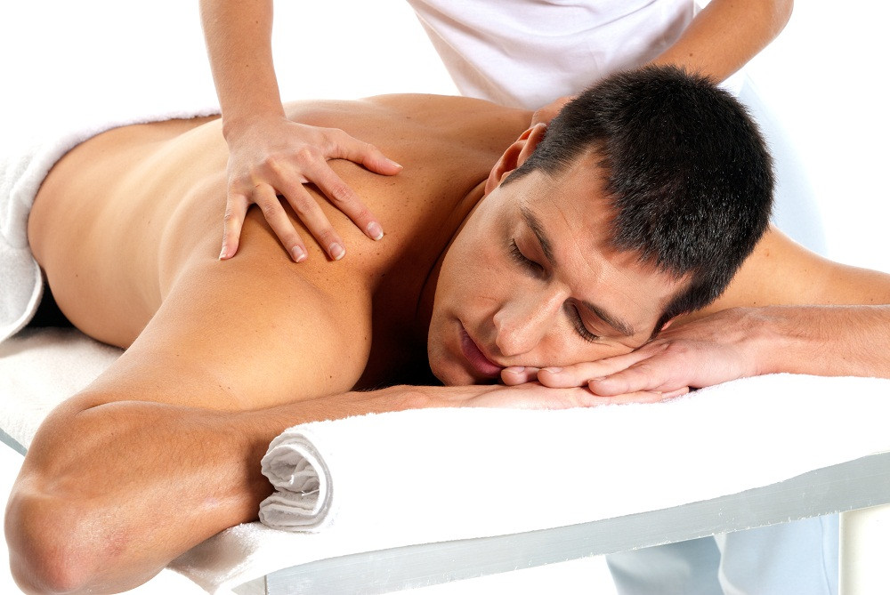 Man Receiving Massage by a student getting their massage therapy certification in Baltimore