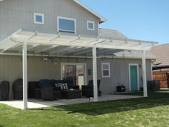white louvered pergola