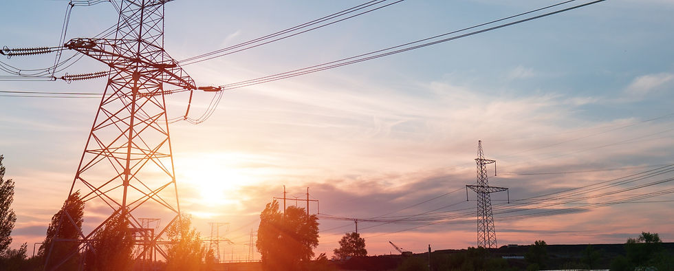 distribution electric substation with power lines and transformers, at sunset_edited.jpg