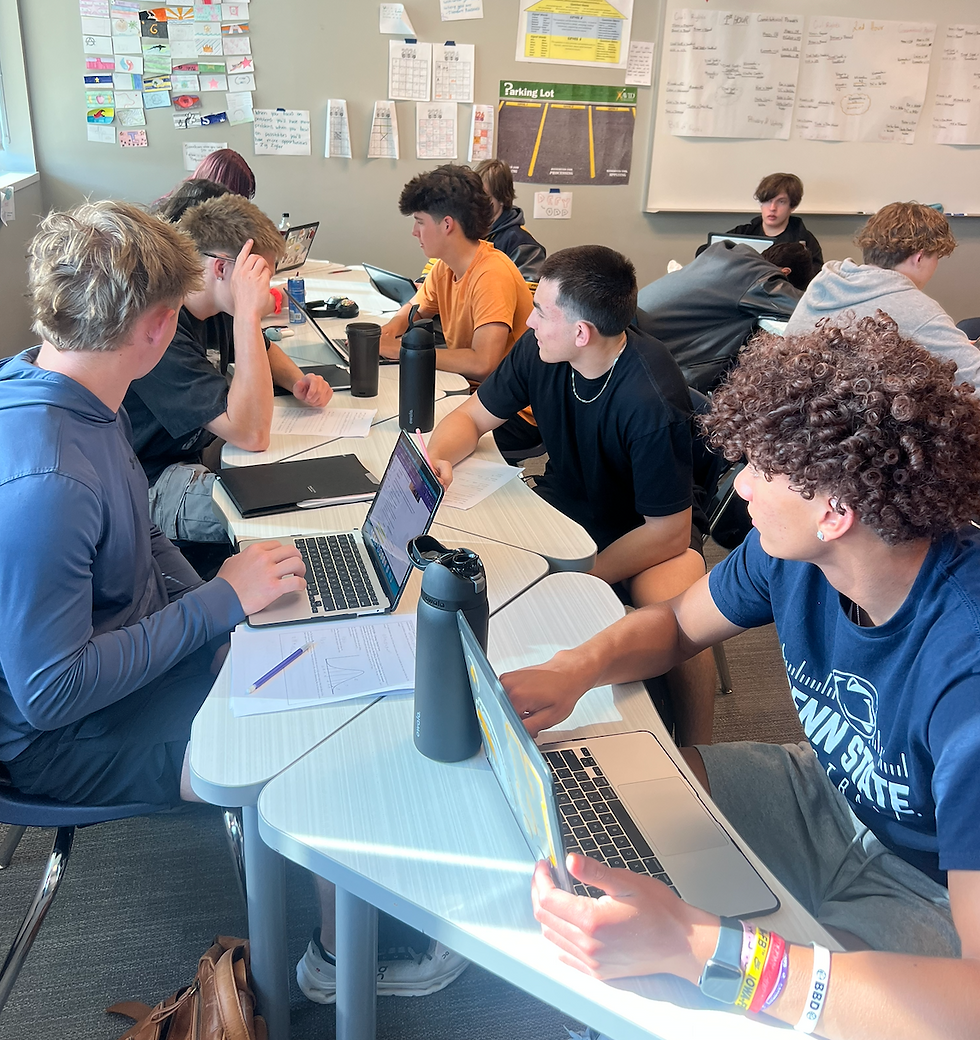 Students participating in a collaborative conversation about economic policies across nations.