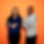two Max Planck scientists standing in front of a orange wall
