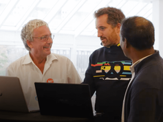 start-up coach working with two interested founders