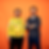 two Max Planck scientists standing in front of a orange wall