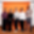 five Max Planck scientists standing in front of a orange wall