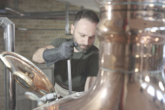 Craftsman brewing beer in a brewery