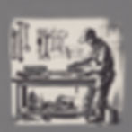 A metal working in his garage working on building a toolbox out of steel.jpg