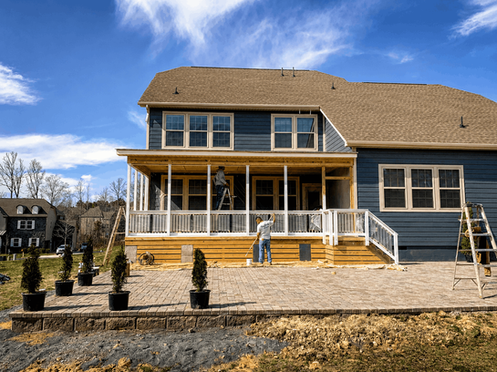 Spacious paver patio with outdoor dining set and steps from screened porch in Charlotte NC