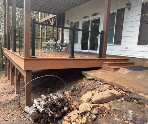 Elevated deck construction with curved support and natural stone below