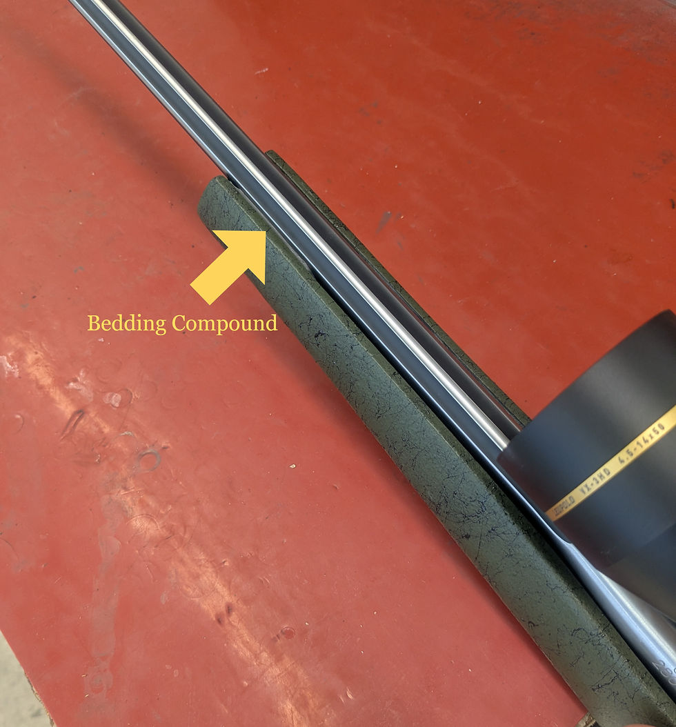 Bedding compound applied in the forend of a Weatherby Mark V stock to bed the barrel and set forend pressure