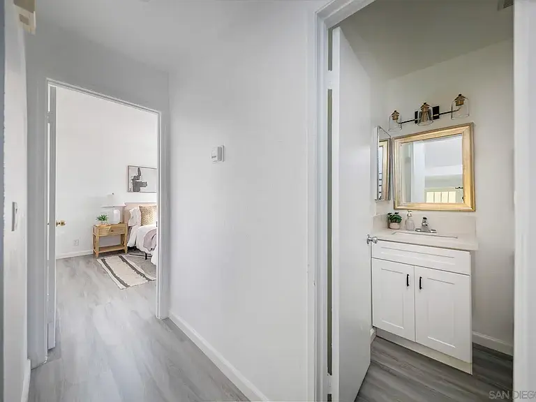 Minimalist staged hallway and bathroom interior