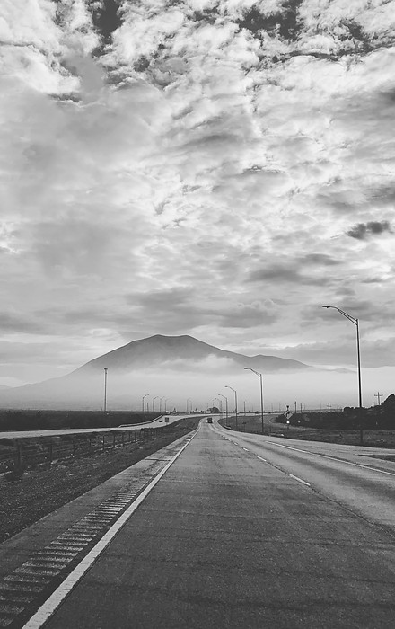 Cloudy mountains with an empty interstate