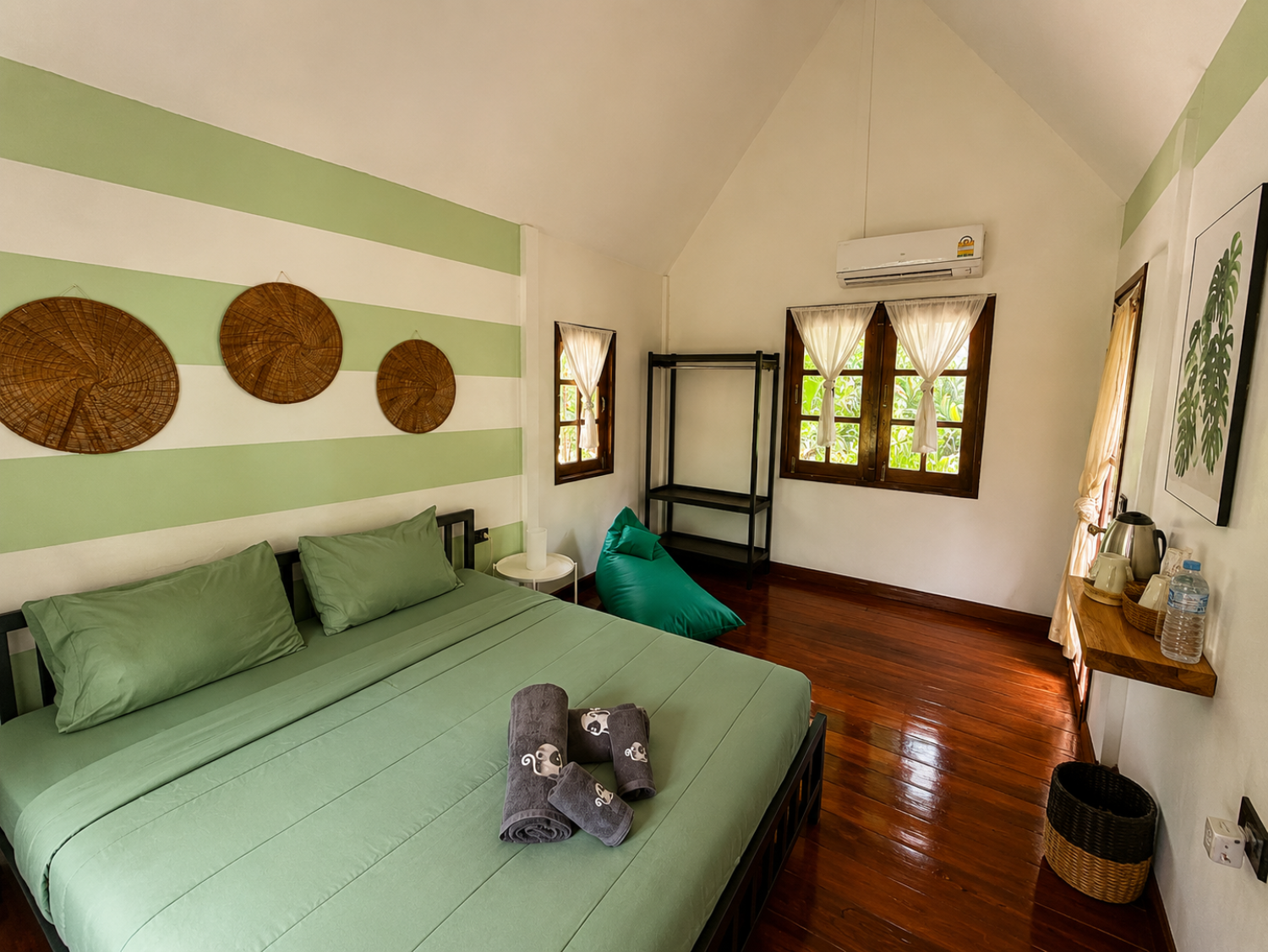 Second interior view of a Garden Bungalow showing its natural materials and open layout