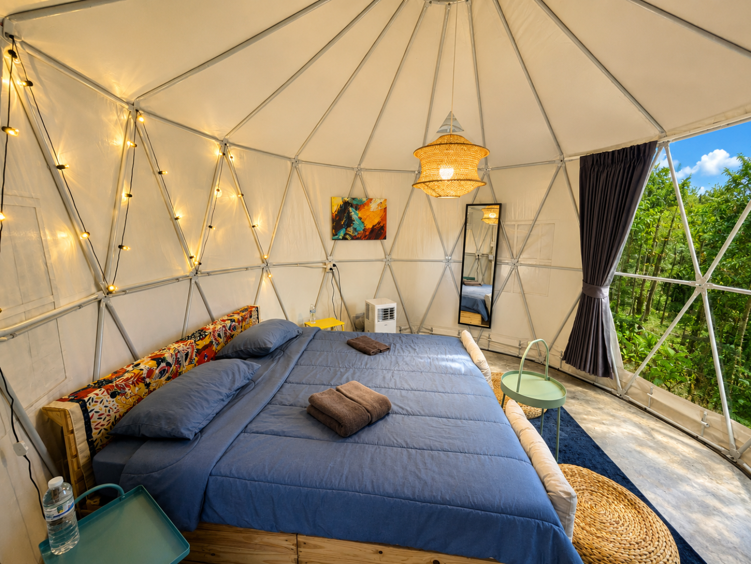 King-size bed inside a Glamping Yurt at Vanara Eco Resort