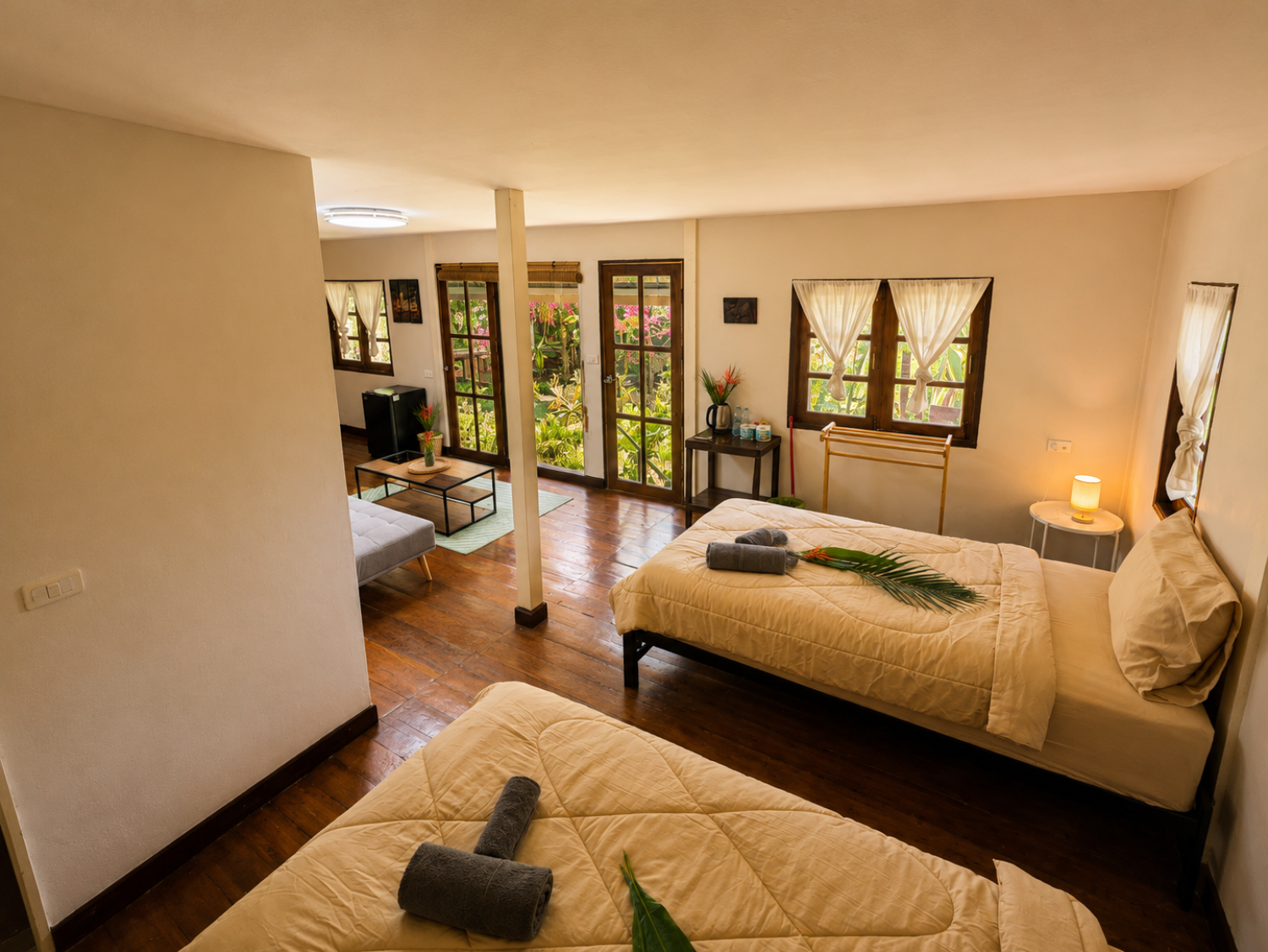Twin sleeping area with two single beds inside a Garden Villa at Vanara Eco Resort