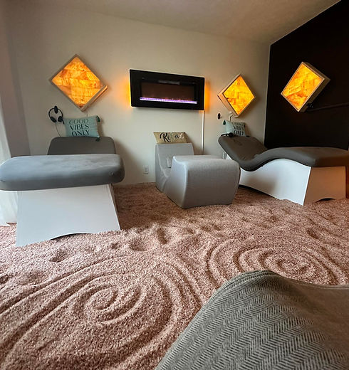 a seat inside a room filled with sand