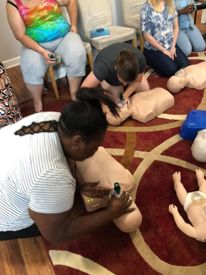 people practicing CPR
