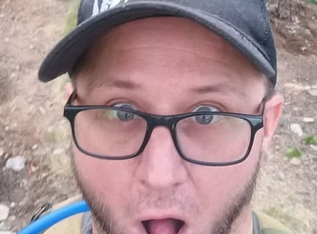 a guy in glasses and hat
