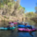 a bunch of people kayaking