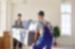2 people moving a couch