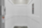 White paneled elevator interior